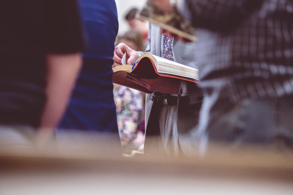 A woman reading the Bible during a church gathering