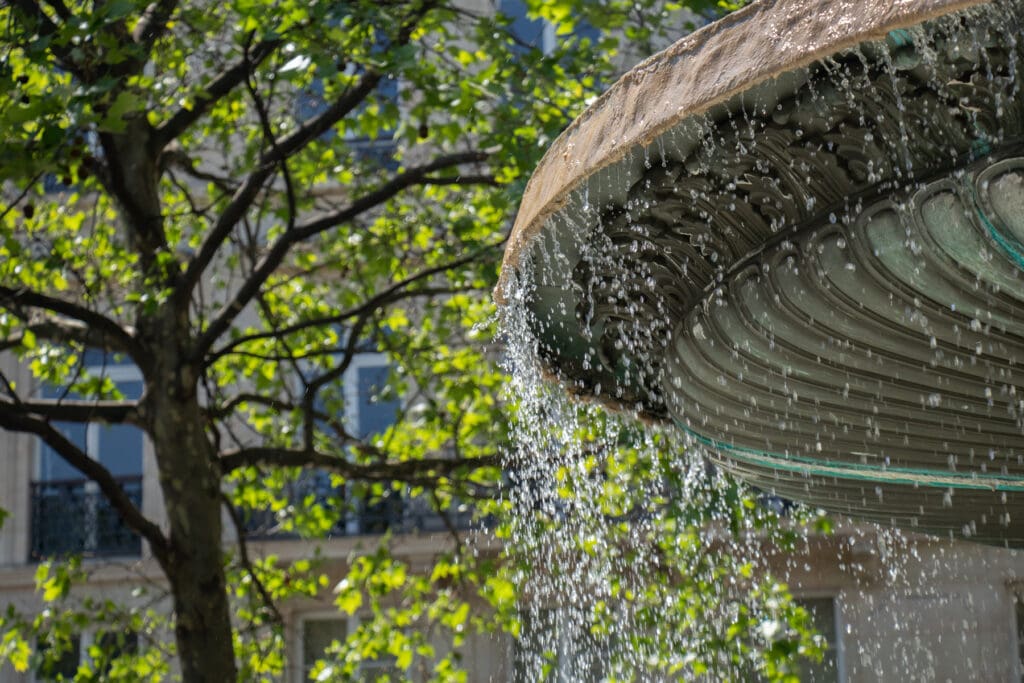 fountain-with-running-water-at-summertime-in-paris-2023-11-27-05-31-01-utc